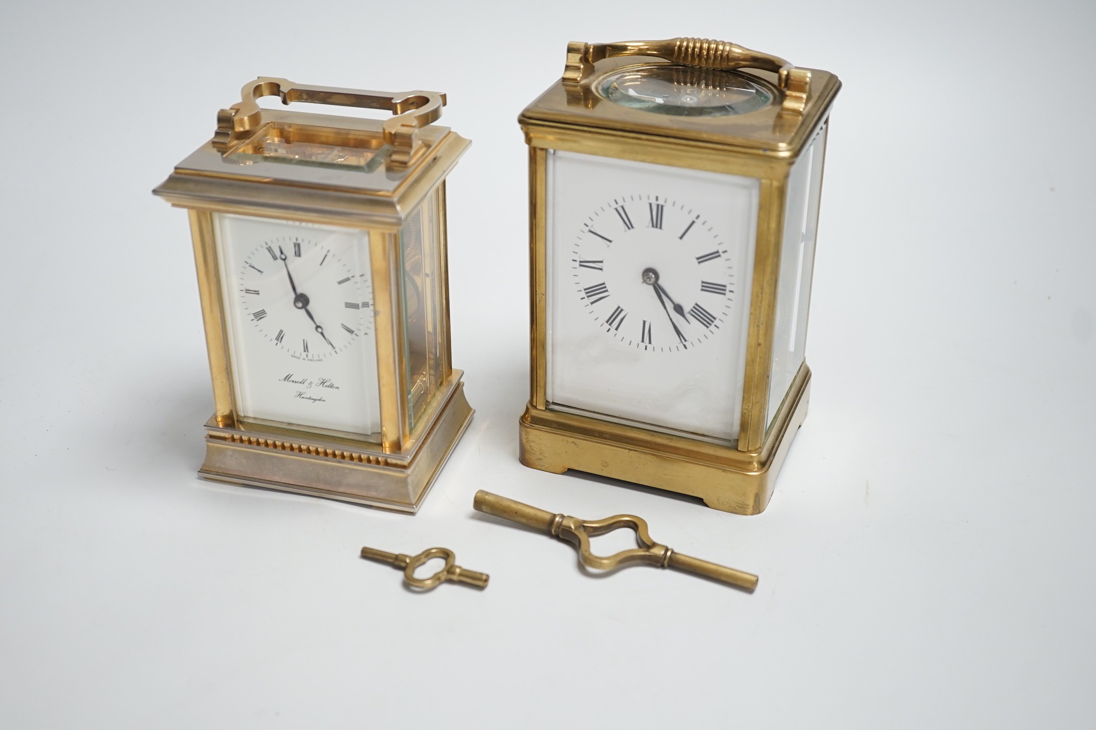 Two English brass carriage clocks with winding keys. Tallest 14.5cm